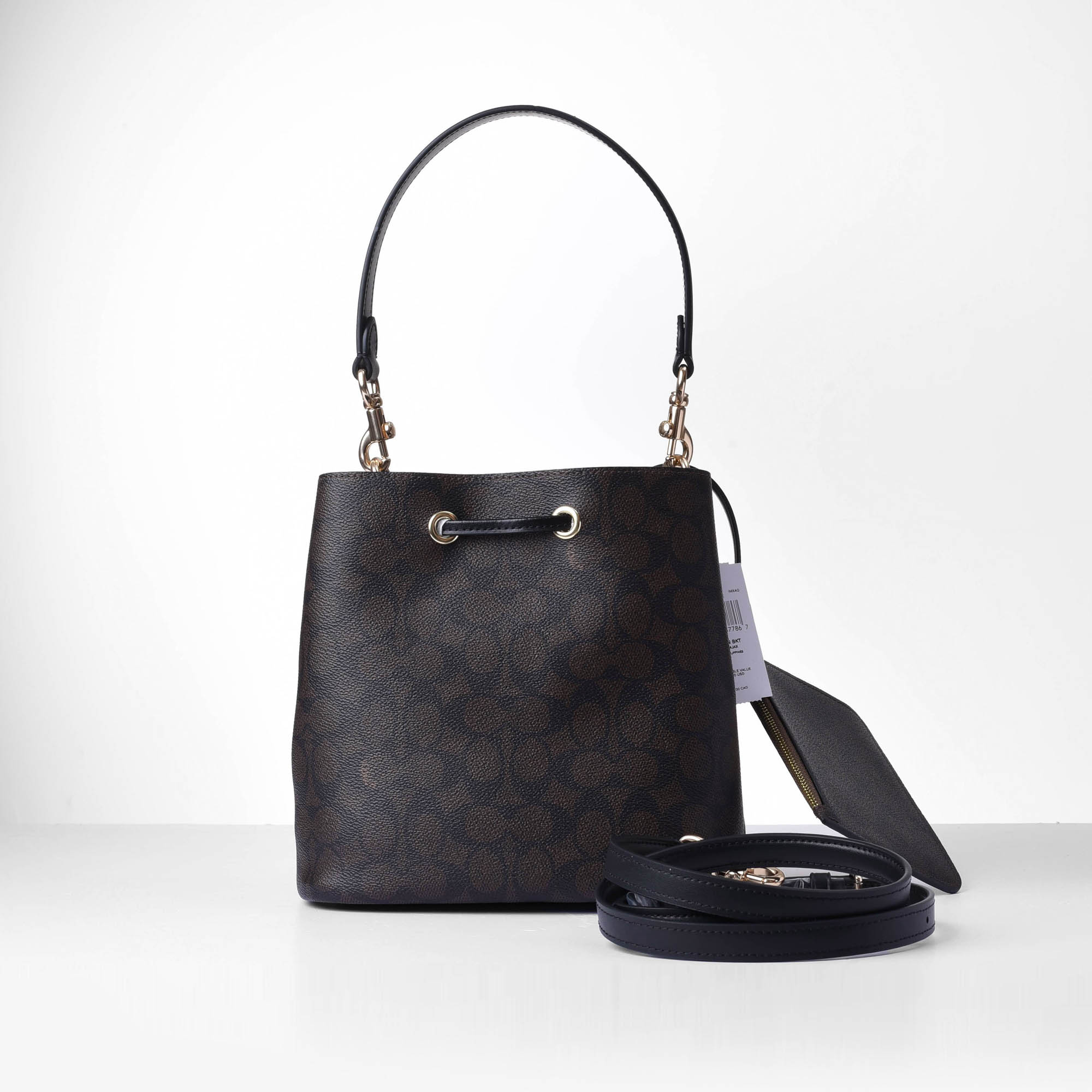 COACH SIGNATURE ROWAN BUCKET BAG - DARK BROWN