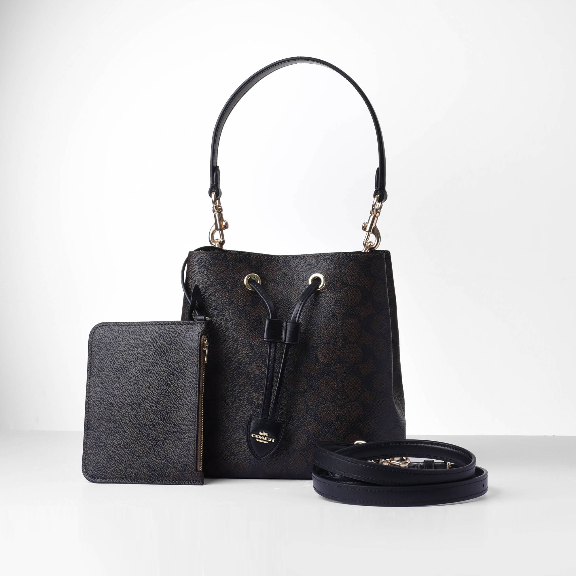 COACH SIGNATURE ROWAN BUCKET BAG - DARK BROWN