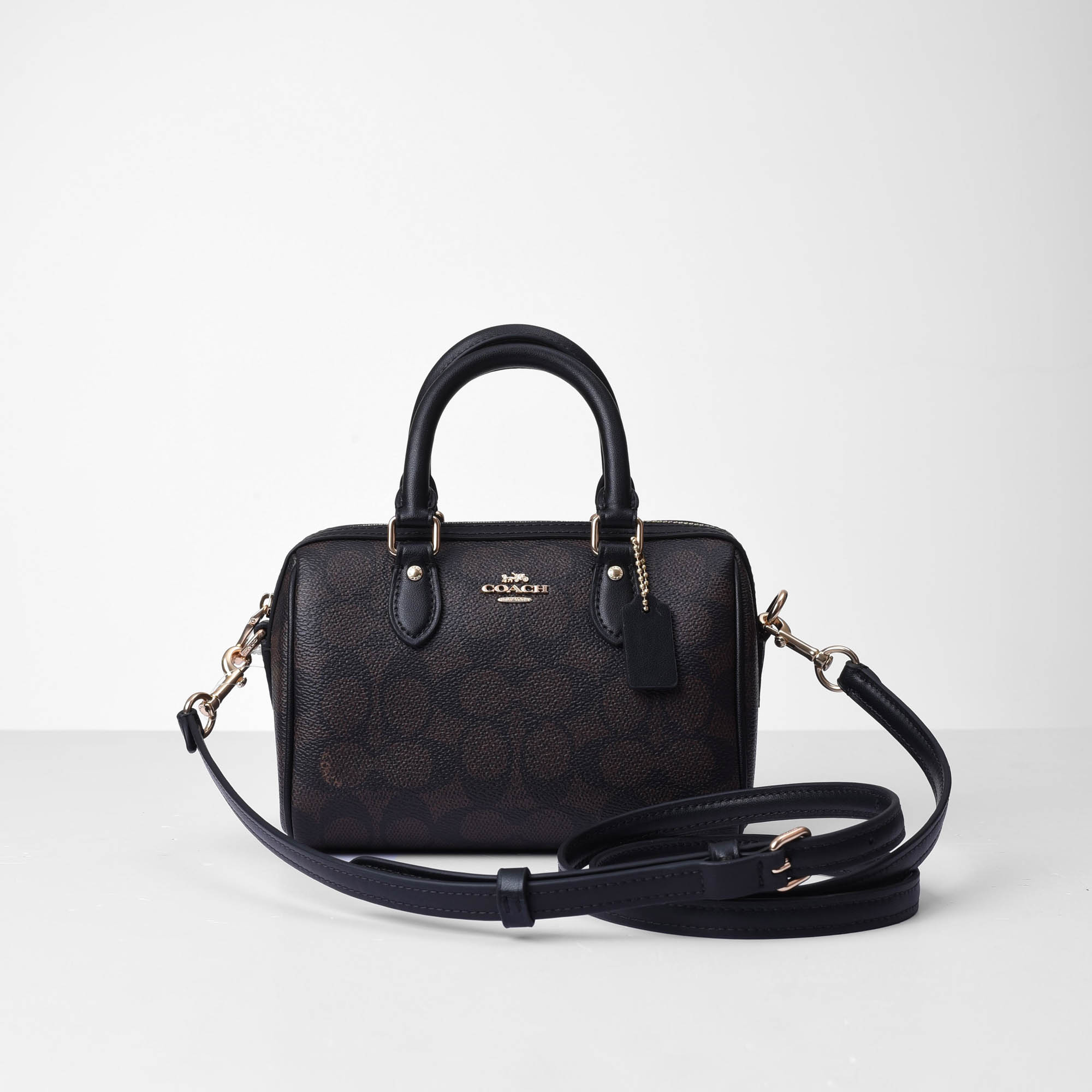 COACH SIGNATURE MINI ROWAN CROSS BAG - DARK BROWN