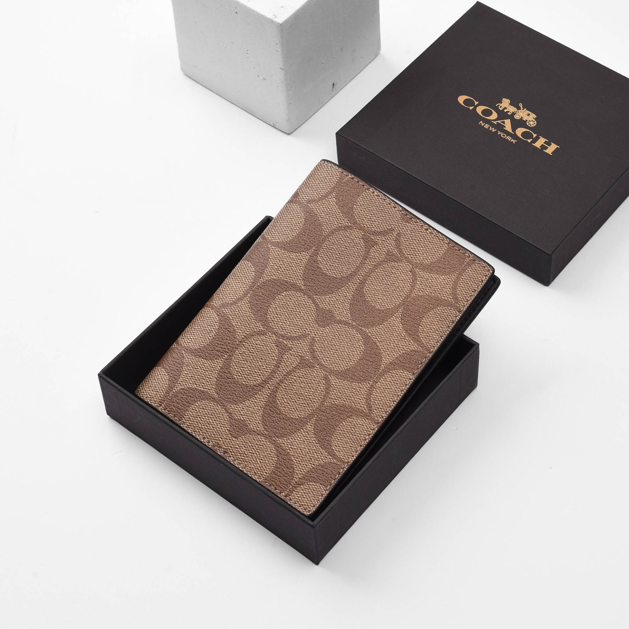 COACH SIGNATURE CANVAS PASSPORT WALLET - BROWN